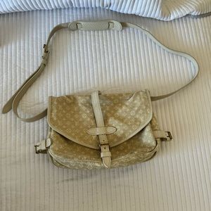 Louis Vuitton messenger bag.